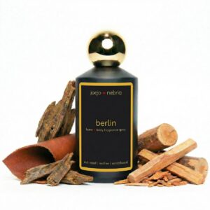 Berlin home and body fragrance spray by JoeJo + Nebria with oud wood, leather, and sandalwood