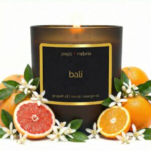 Bali scented candle by JoeJo + Nebria in amber glass jar with grapefruit, neroli, and orange oil