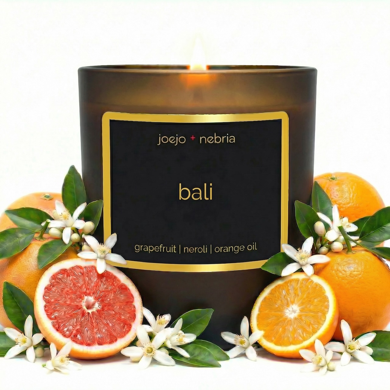 Bali scented candle by JoeJo + Nebria in amber glass jar with grapefruit, neroli, and orange oil