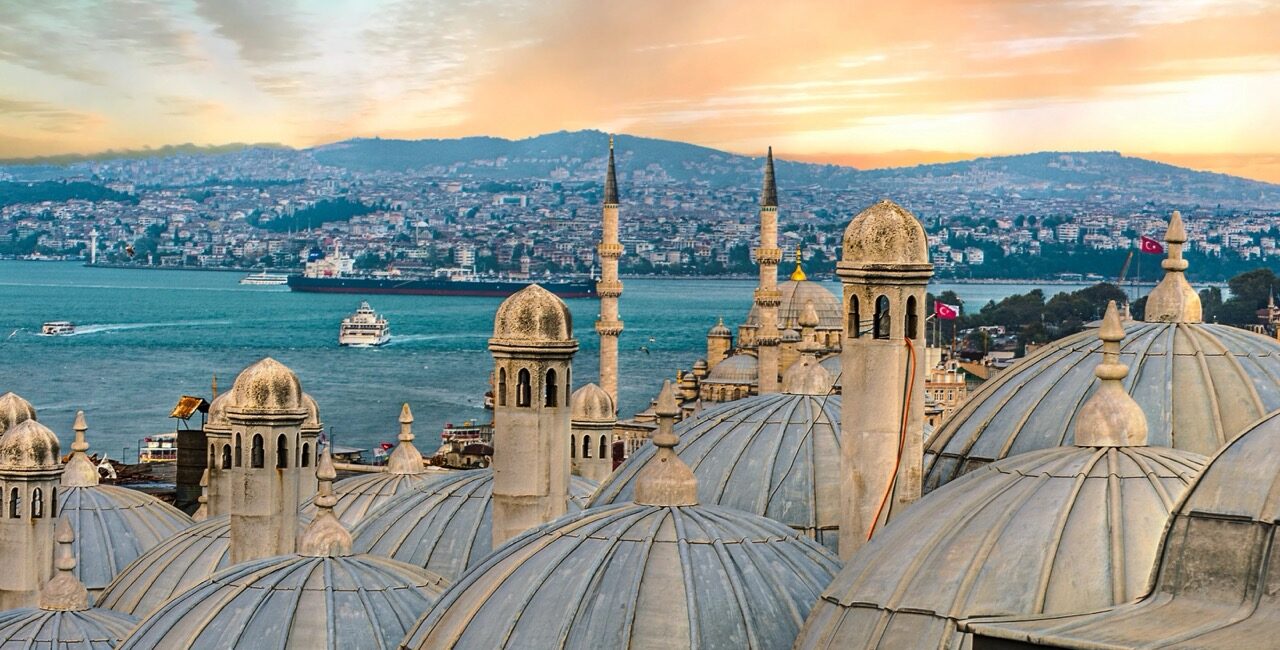 Istanbul skyline with mosque domes and Bosphorus at sunset