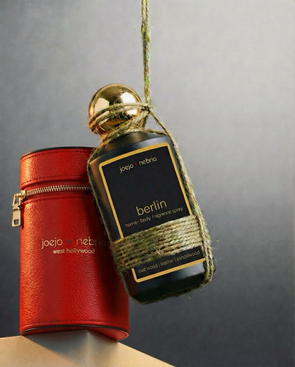 Berlin home and body fragrance spray by JoeJo + Nebria with red vegan leather container and gold cap