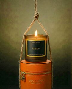 Istanbul scented candle in orange vegan leather container with amber oud fragrance and twine wrap